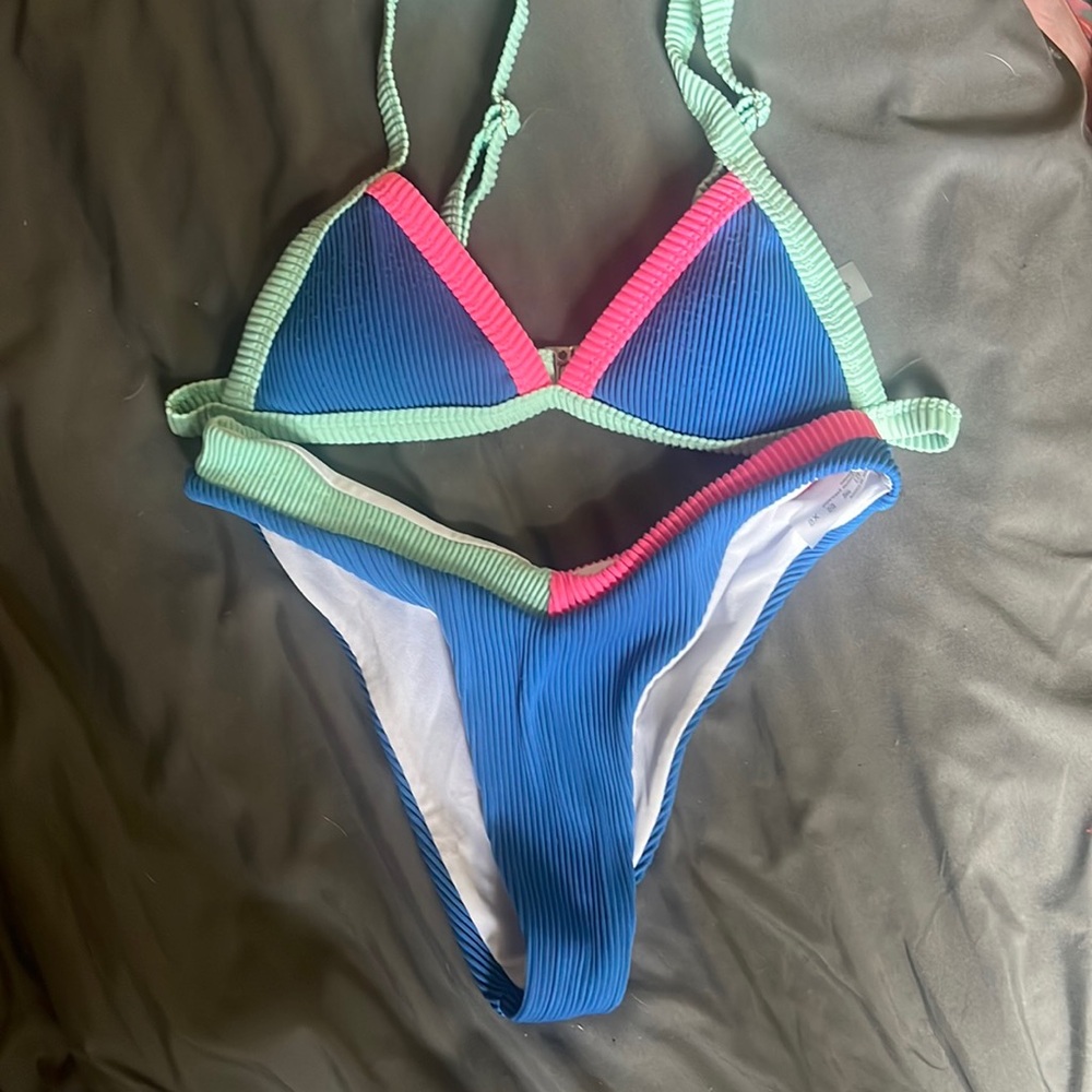Bikini worn a couple times. Fits to size with adjustable straps
